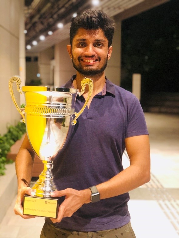 Photo of Piyush holding the trophy