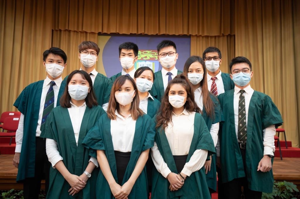 Photo of Vincent with students at Lok Yew Hall