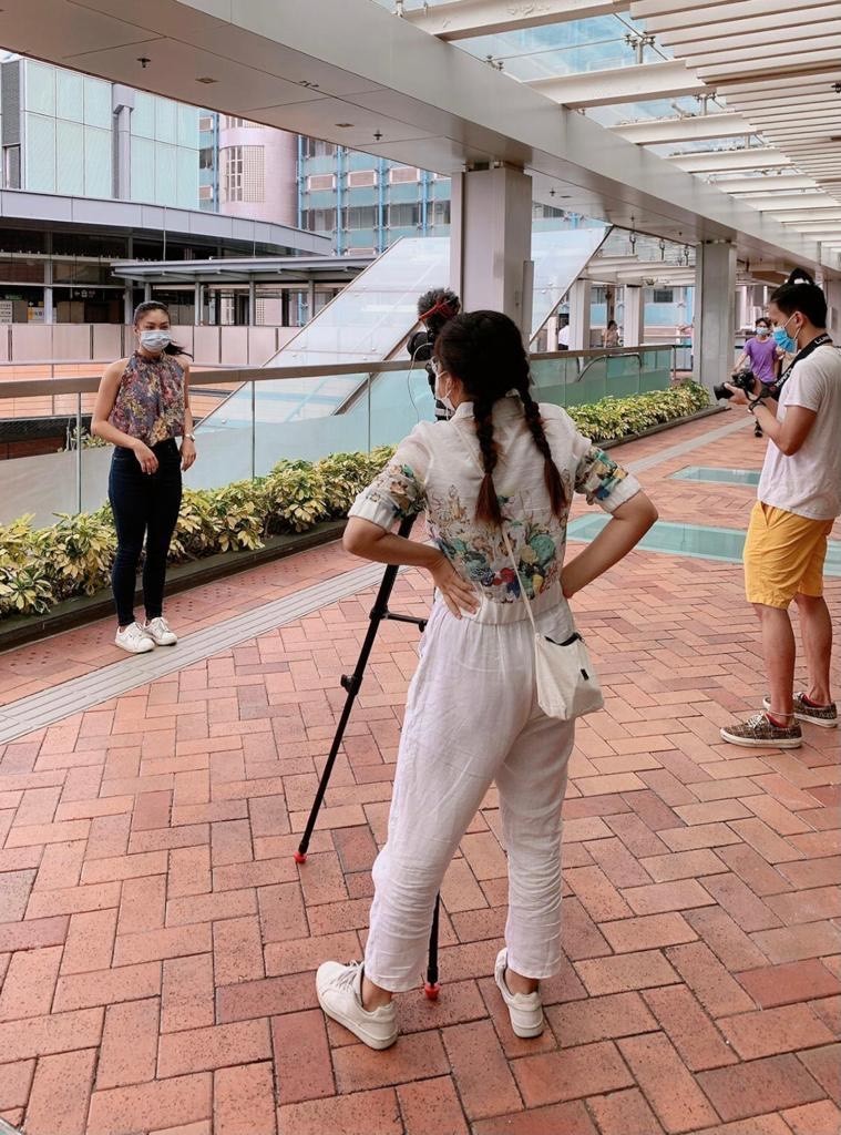 Photo of Grace filming at HKU