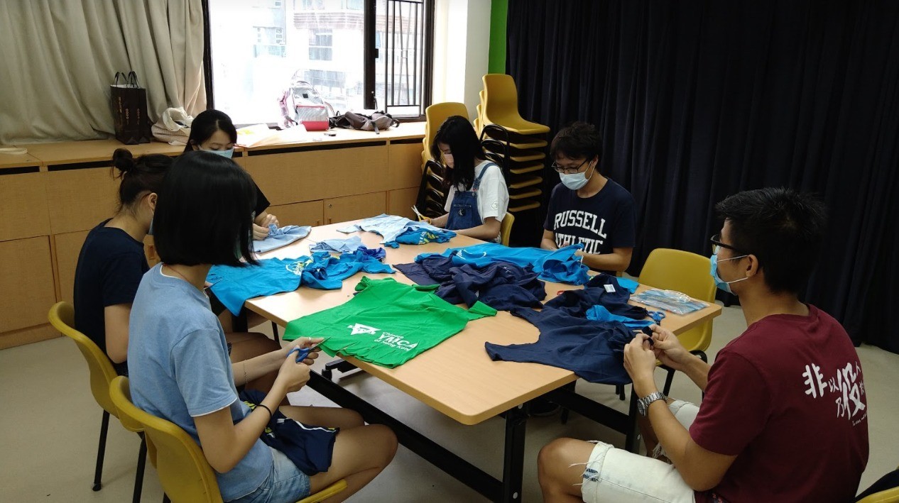 Photo of Hong Yuh Dong preparing the material for making face mask