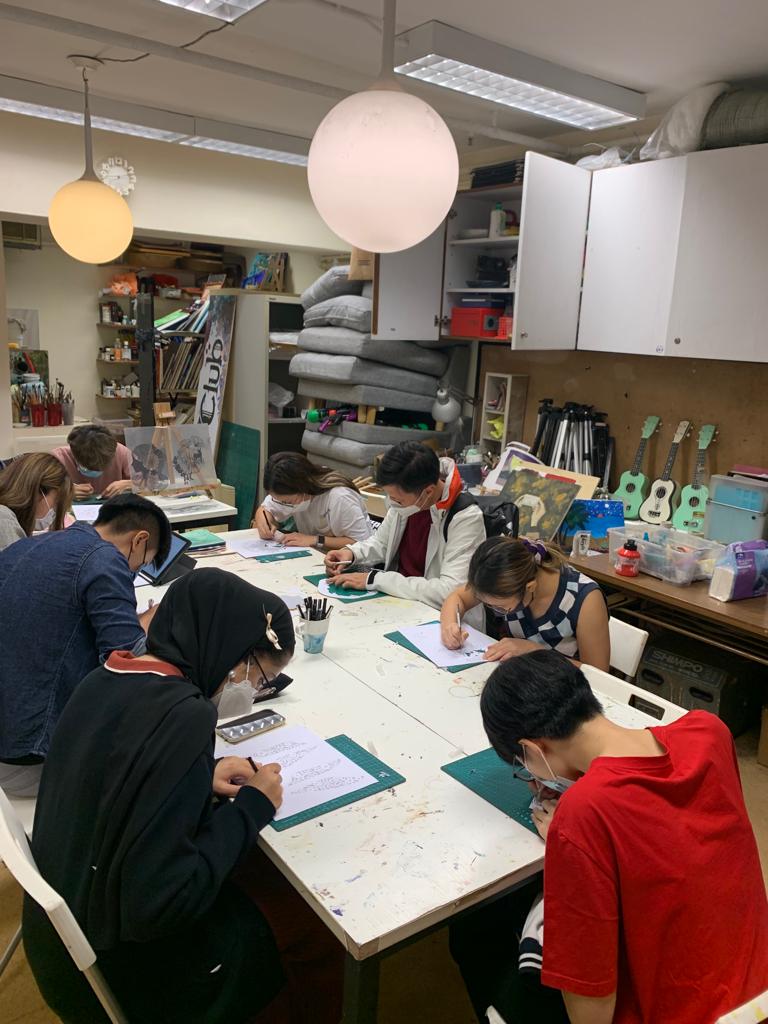 Students are participating in a paper-cutting workshop.