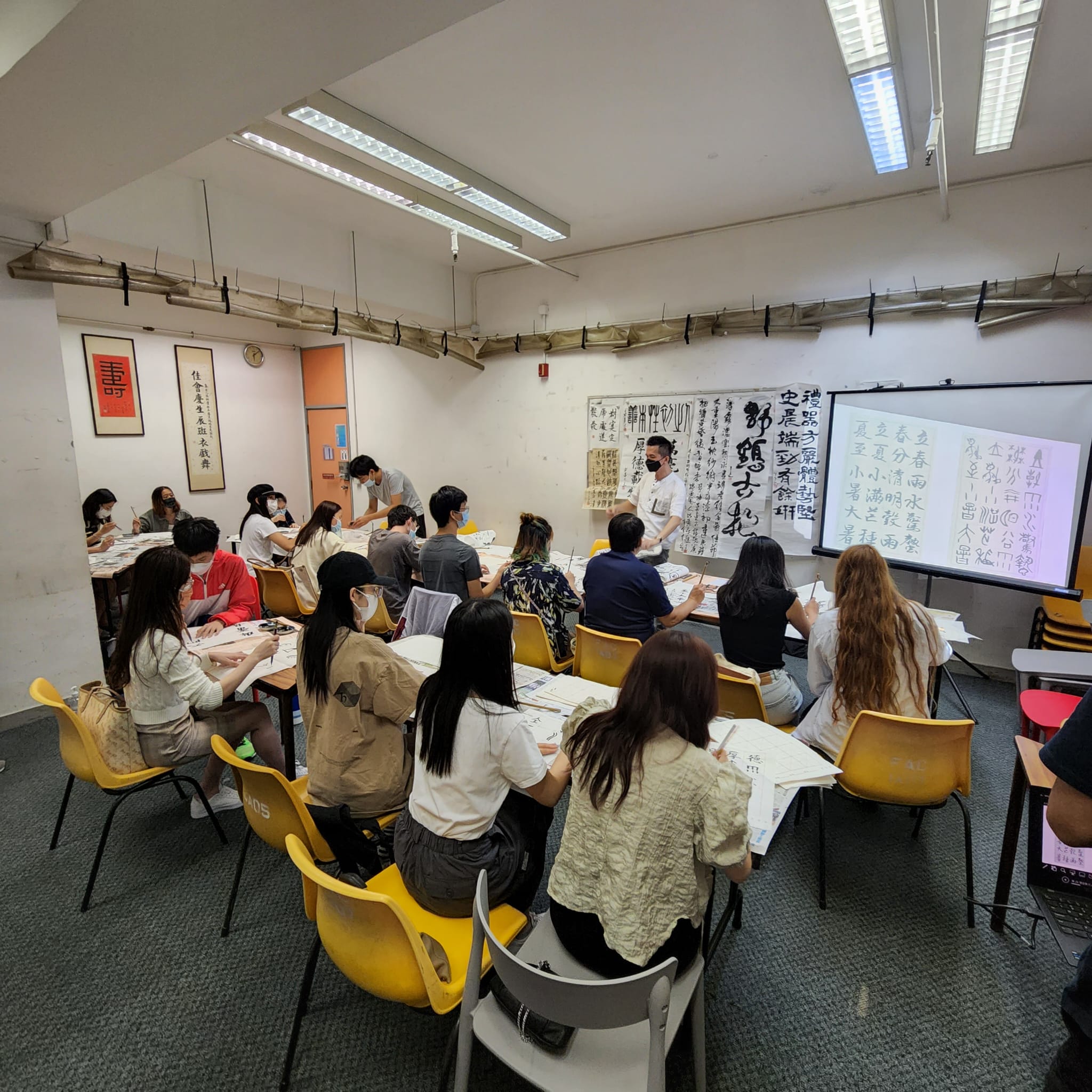 Students are participating in a Clerical Script Workshop.